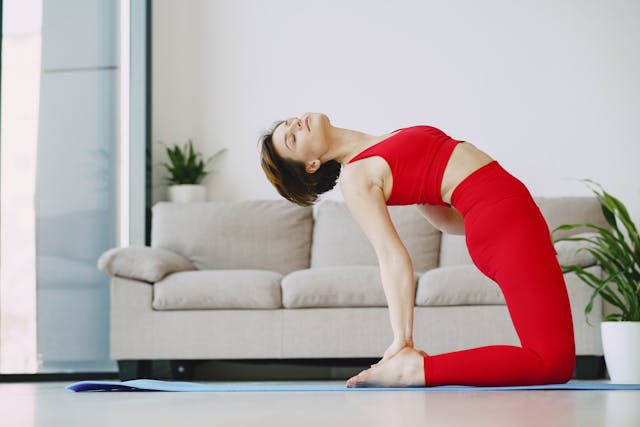 woman performing camel pose, extreme backward bend
