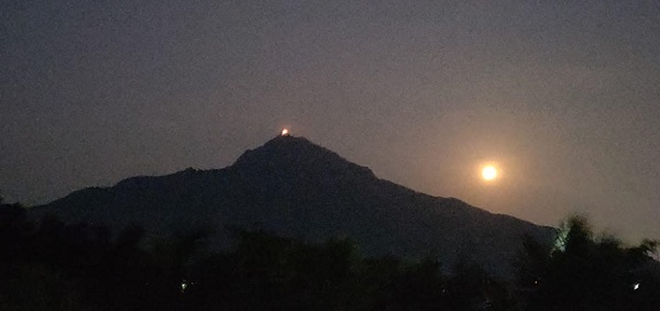 light on top of Arunachala hill during Kartikai Deepam festival